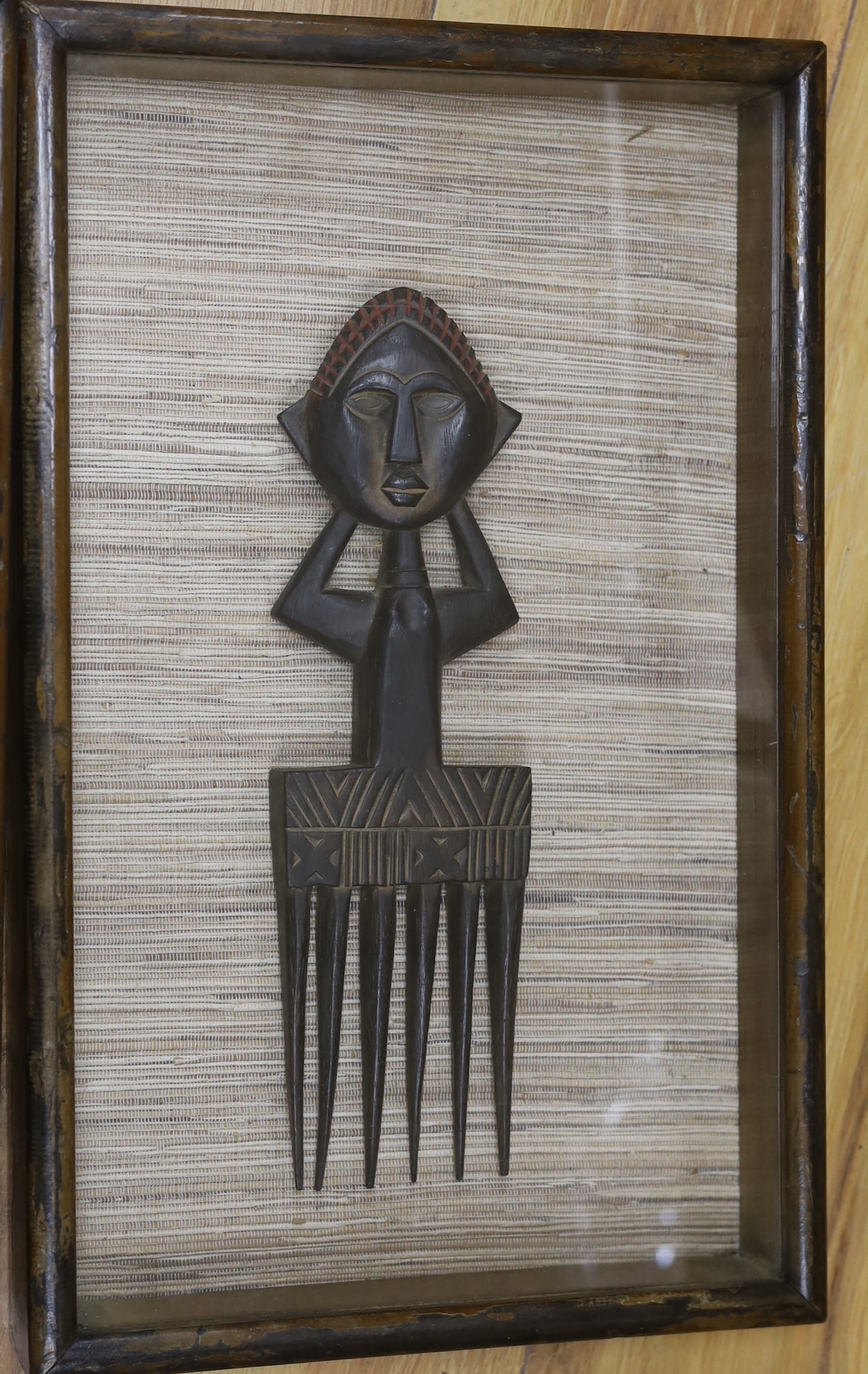 A pair of framed Ashanti combs